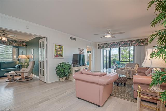 4120 Lorene Drive, Unit 101 Estero, FL 33928 - Photo 4 of 45 a living room with furniture and potted plants