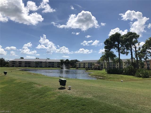 4120 Lorene Drive, Unit 101 Estero, FL 33928 - Photo 42 of 45 a view of a lake with a big yard