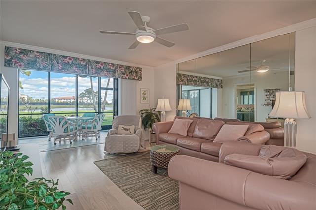4120 Lorene Drive, Unit 101 Estero, FL 33928 - Photo 5 of 45 a living room with furniture and a large window with balcony view