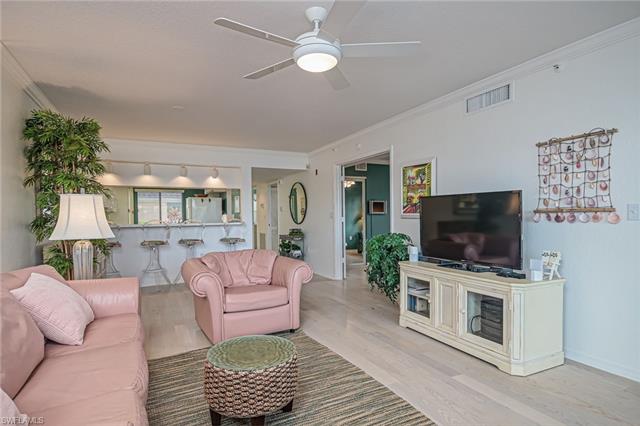 4120 Lorene Drive, Unit 101 Estero, FL 33928 - Photo 7 of 45 a living room with furniture and a flat screen tv