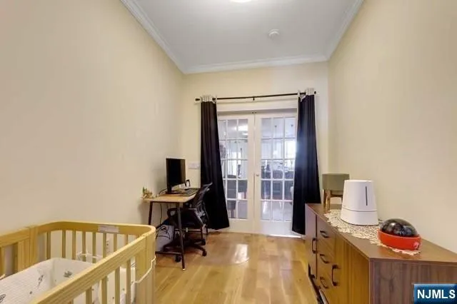 a bedroom with furniture and a wooden floor