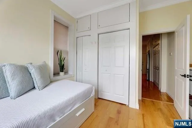 a room with a bed and a mirror