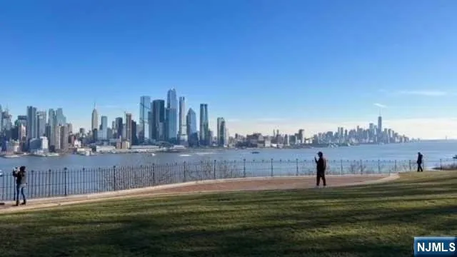 a view of a water with a field