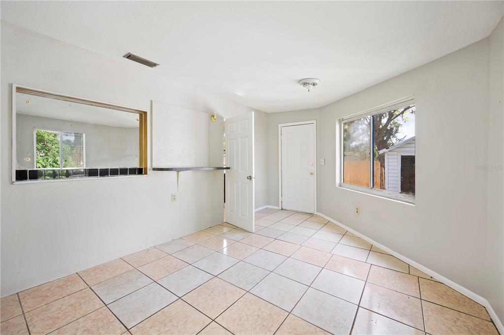 3221 Crutchfield Road Lakeland, FL 33805 - Photo 17 of 49 a view of an empty room with a window