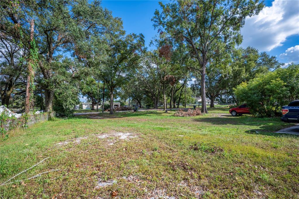 3221 Crutchfield Road Lakeland, FL 33805 - Photo 31 of 49 a view of outdoor space with deck and trees