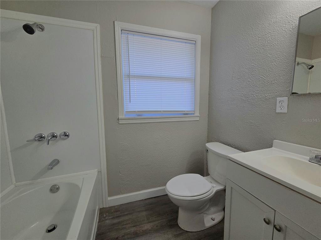 3221 Crutchfield Road Lakeland, FL 33805 - Photo 37 of 49 a white toilet sitting next to a bath tub