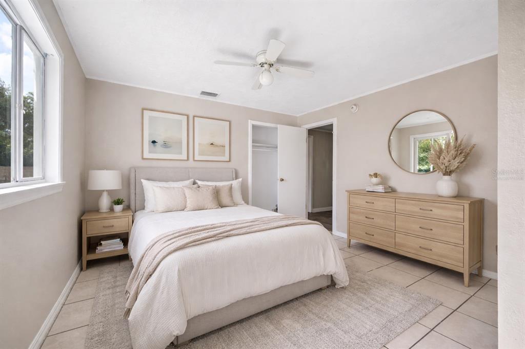 3221 Crutchfield Road Lakeland, FL 33805 - Photo 4 of 49 a bedroom with a bed and a dresser