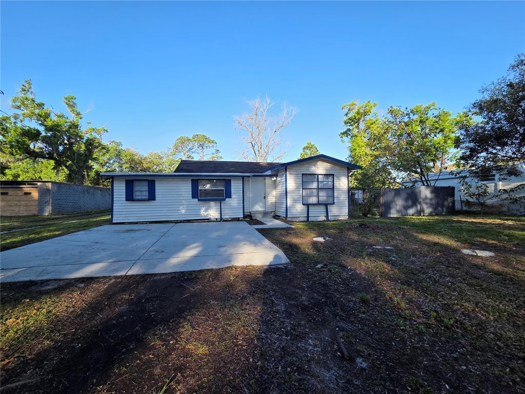 3221 Crutchfield Road Lakeland, FL 33805 - Photo 48 of 49 a front view of a house with a yard