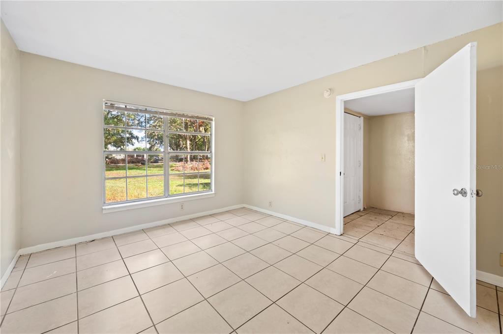 3221 Crutchfield Road Lakeland, FL 33805 - Photo 9 of 49 a view of an empty room with window