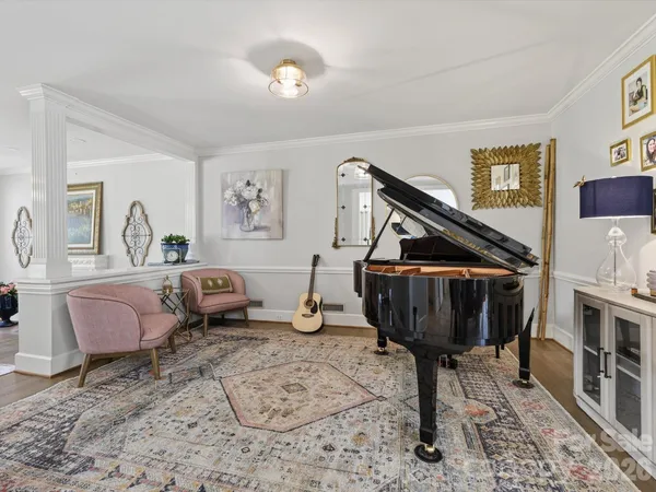 a living room with furniture a fireplace and a table