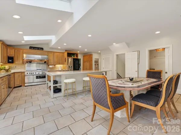 a dining room with furniture and window