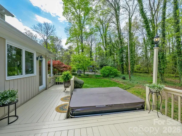 a view of a house with backyard sitting area and garden