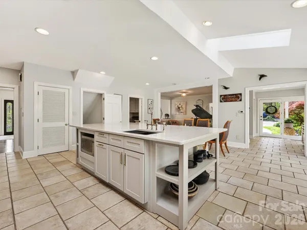 a kitchen with stainless steel appliances a sink and counter space