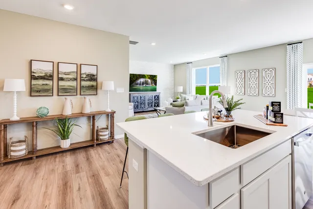 a kitchen with a sink a counter top space and a window