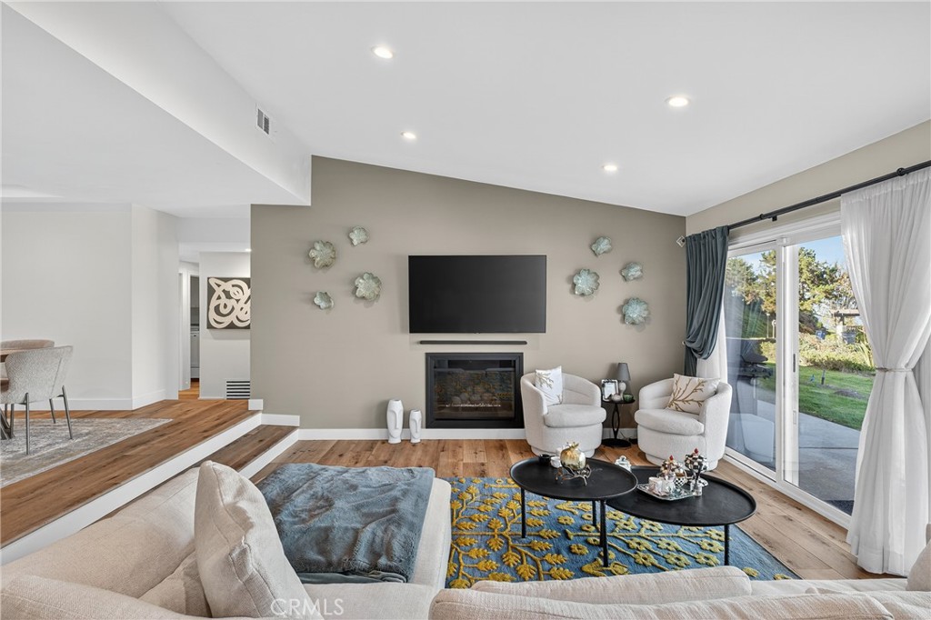5 Cypress Way Rolling Hills Estates, CA 90274 - Photo 11 of 45 a living room with furniture a flat screen tv and a fireplace