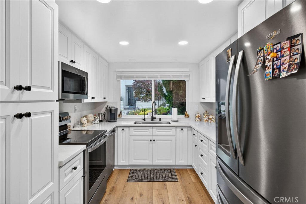 5 Cypress Way Rolling Hills Estates, CA 90274 - Photo 23 of 45 a kitchen with a sink stove and refrigerator