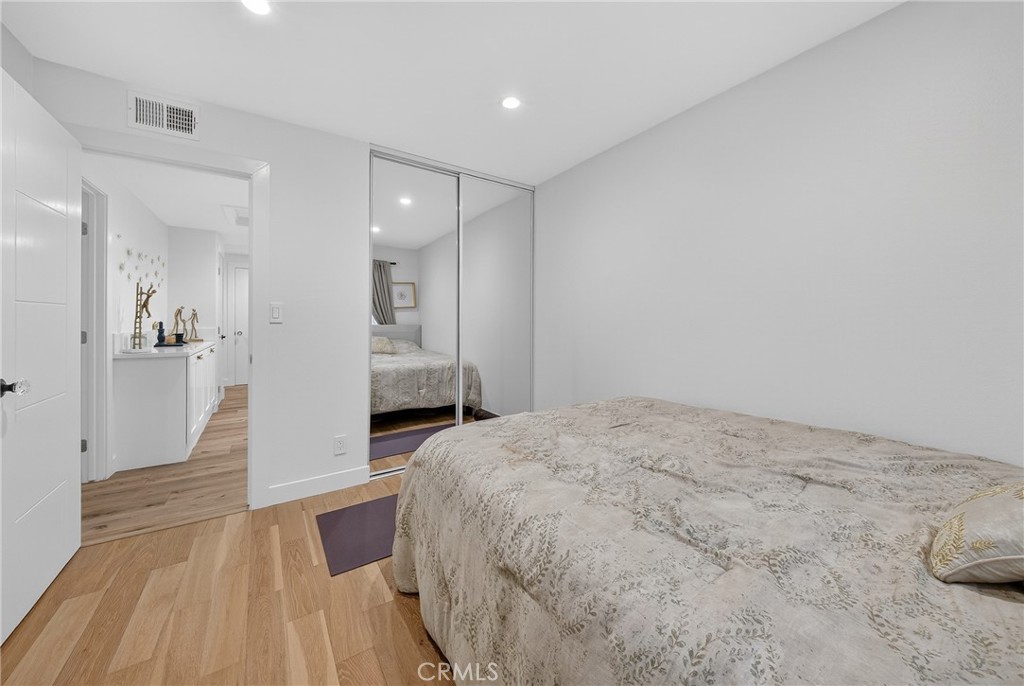 5 Cypress Way Rolling Hills Estates, CA 90274 - Photo 30 of 45 a spacious bedroom with a bed and a view of bathroom