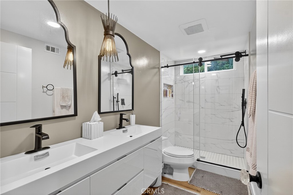 5 Cypress Way Rolling Hills Estates, CA 90274 - Photo 33 of 45 a bathroom with a toilet sink shower and mirror