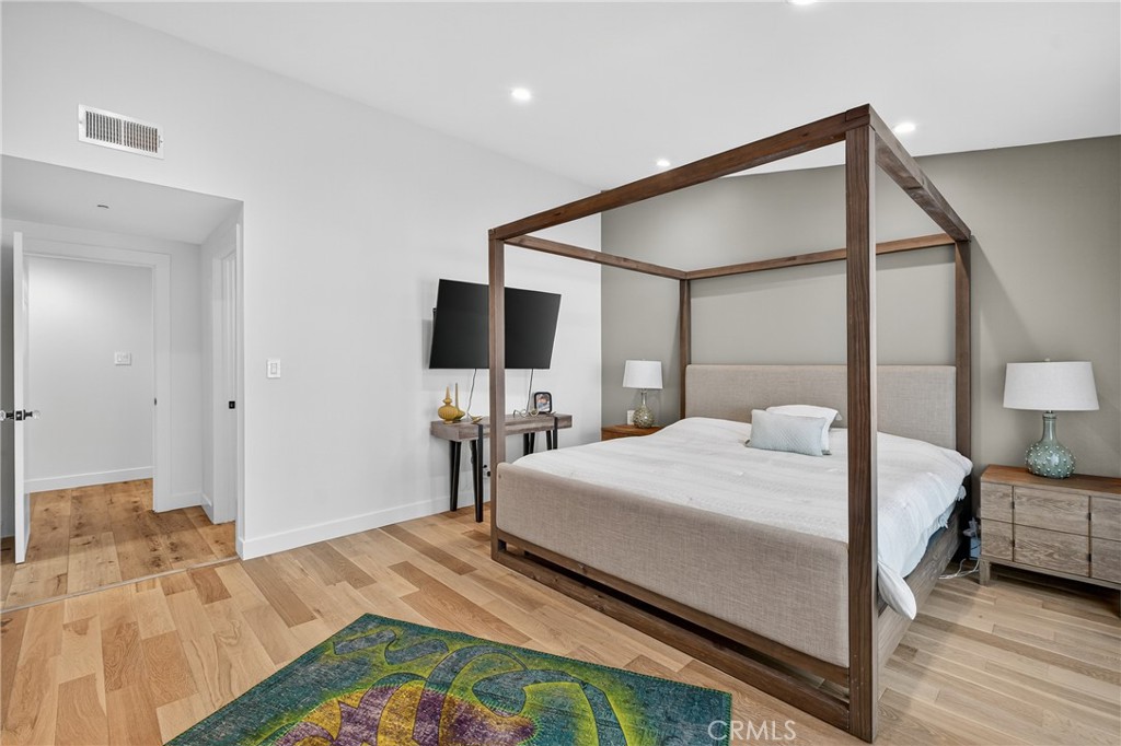 5 Cypress Way Rolling Hills Estates, CA 90274 - Photo 35 of 45 a bedroom with a bed and a flat tv screen on dresser