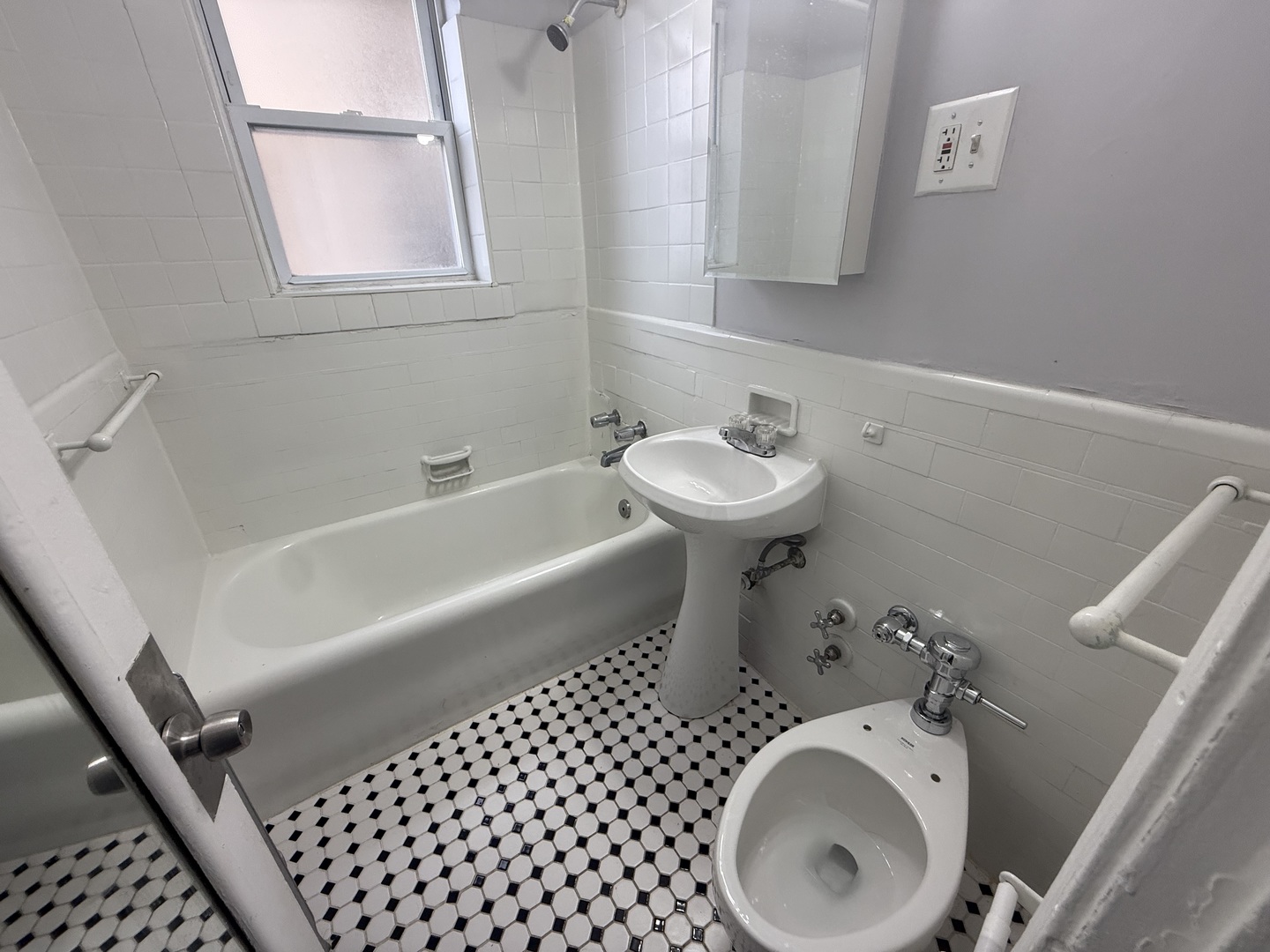 6930 North Greenview Avenue, Unit 509 Chicago, IL 60626 - Photo 9 of 10 a bathroom with a sink and a mirror