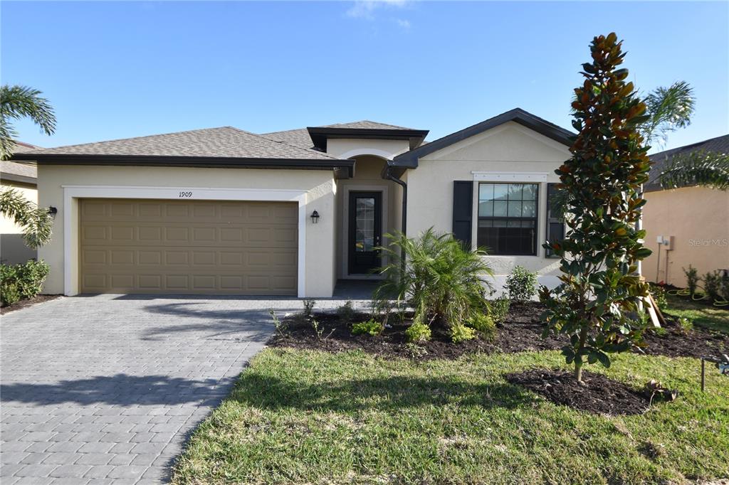 1909 East Isles Rd Port Punta Gorda, FL 33955 - Photo 1 of 1 a front view of house with yard
