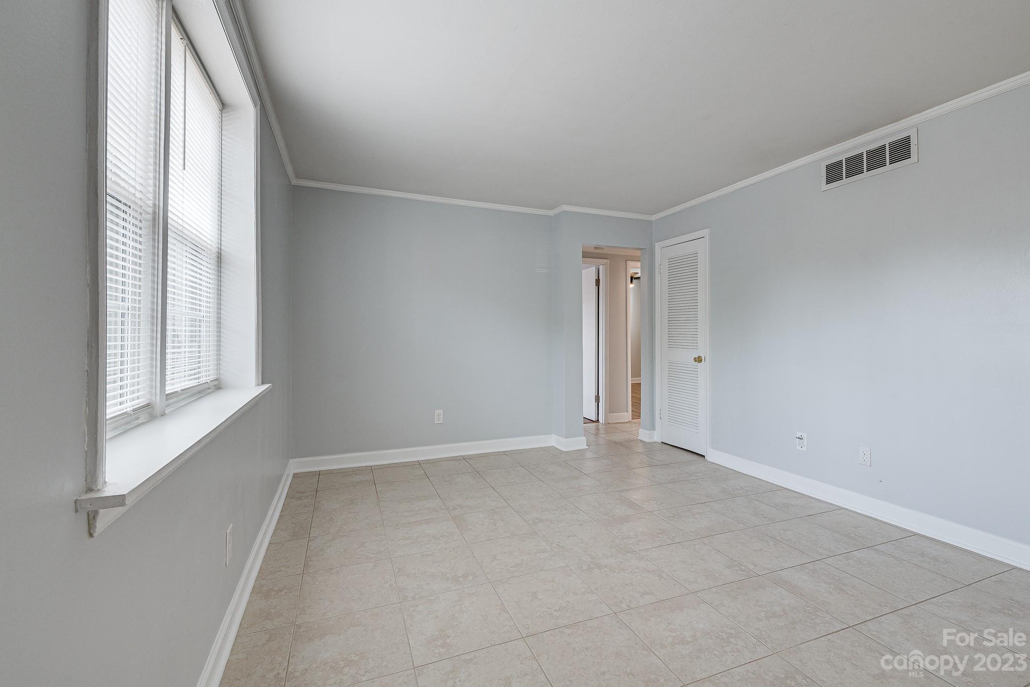 910 McAlway Road, Unit B Charlotte, NC 28211 - Photo 12 of 37 a view of an empty room with a window