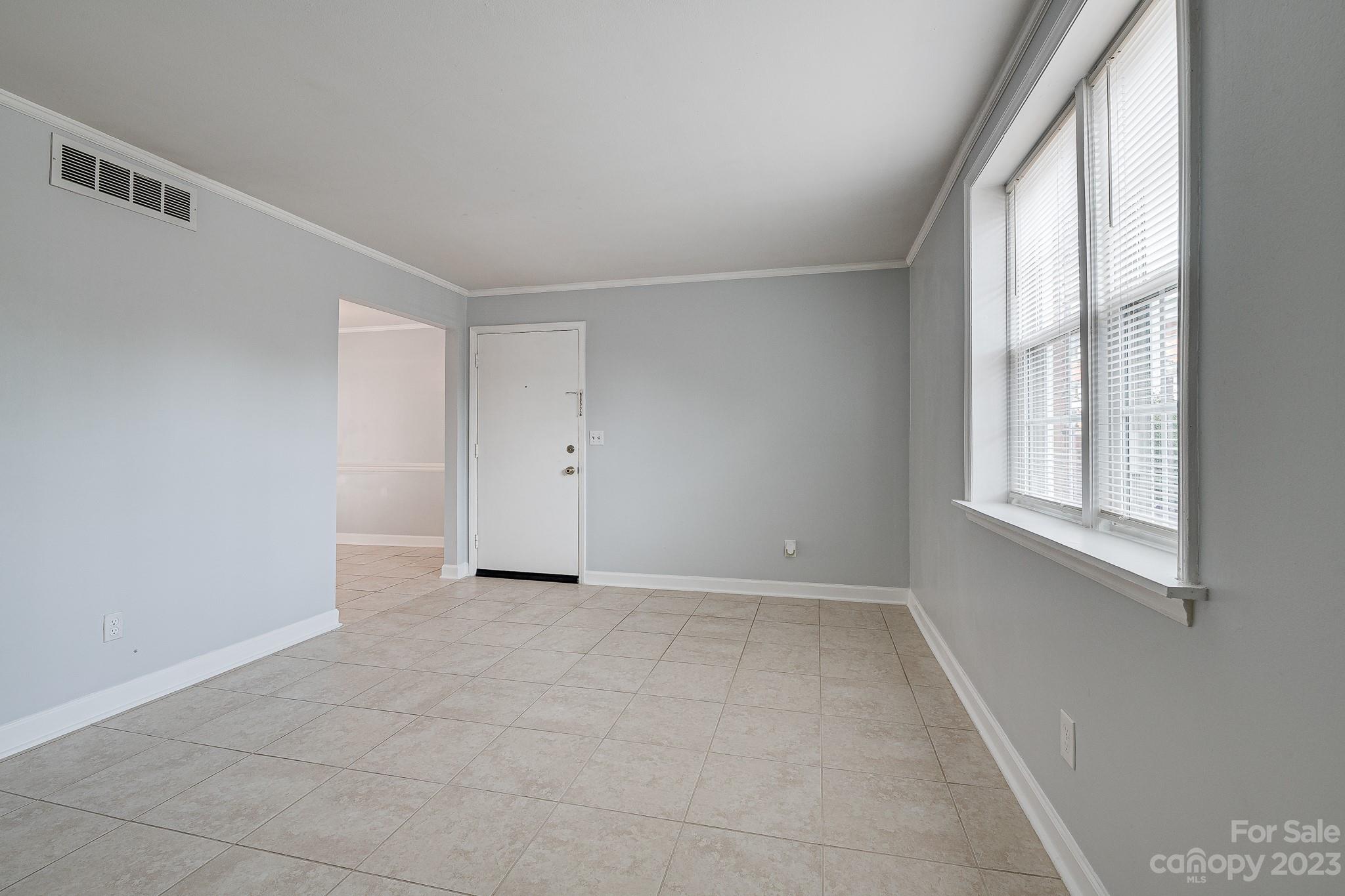 910 McAlway Road, Unit B Charlotte, NC 28211 - Photo 14 of 37 a view of an empty room with a window