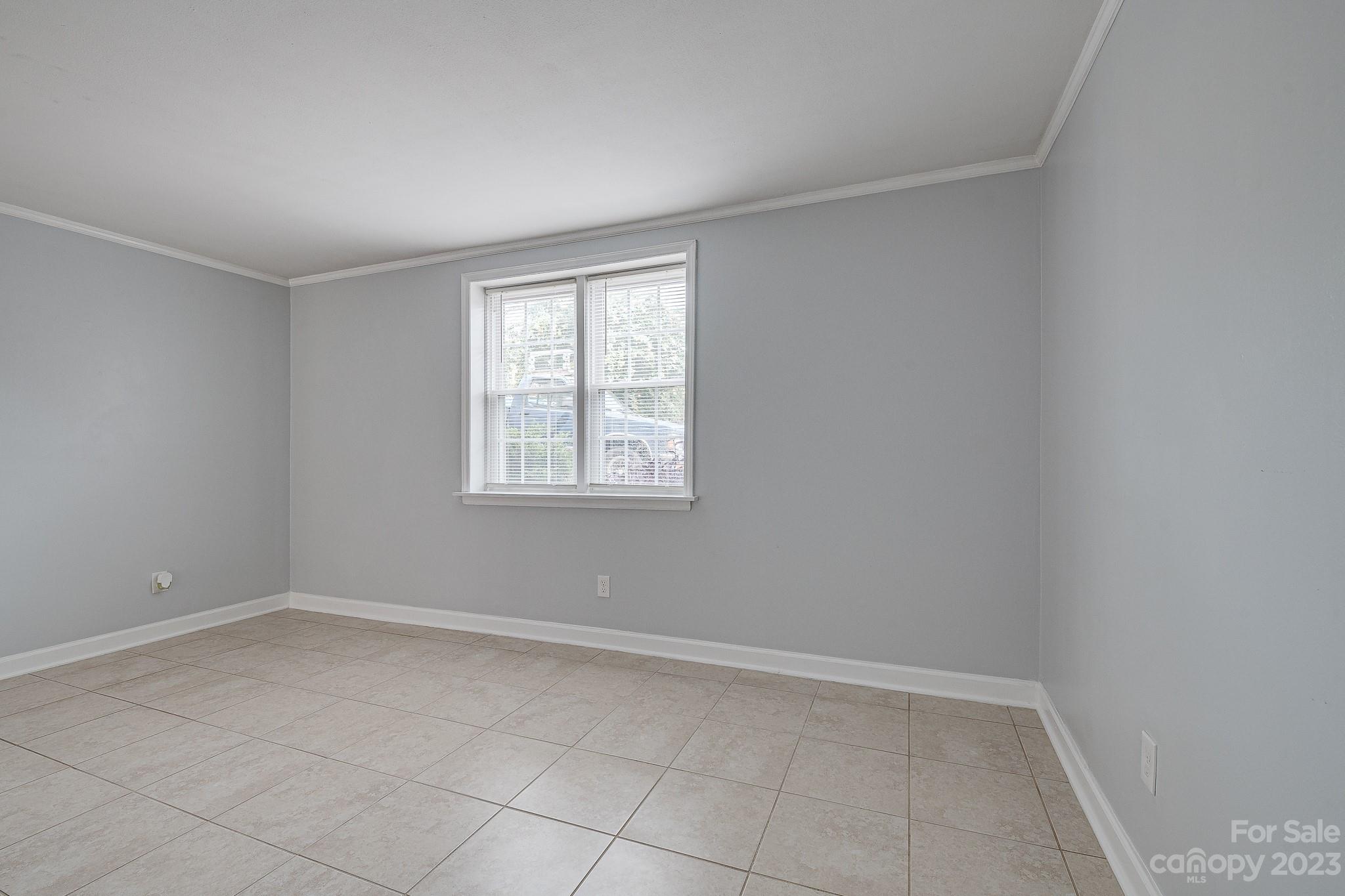 910 McAlway Road, Unit B Charlotte, NC 28211 - Photo 15 of 37 an empty room with windows