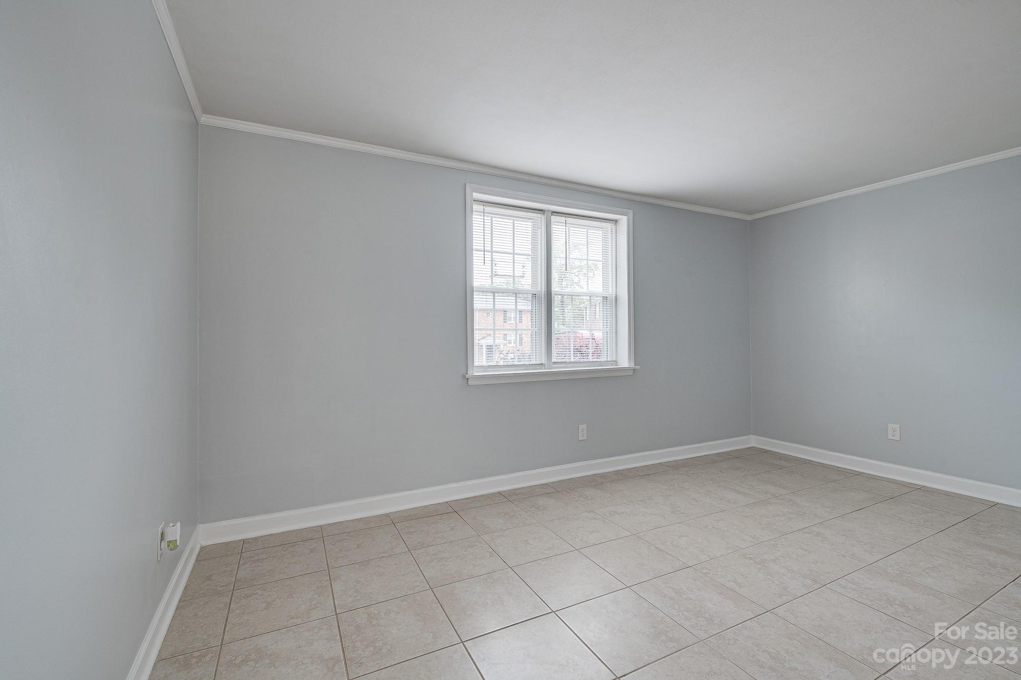 910 McAlway Road, Unit B Charlotte, NC 28211 - Photo 16 of 37 an empty room with windows