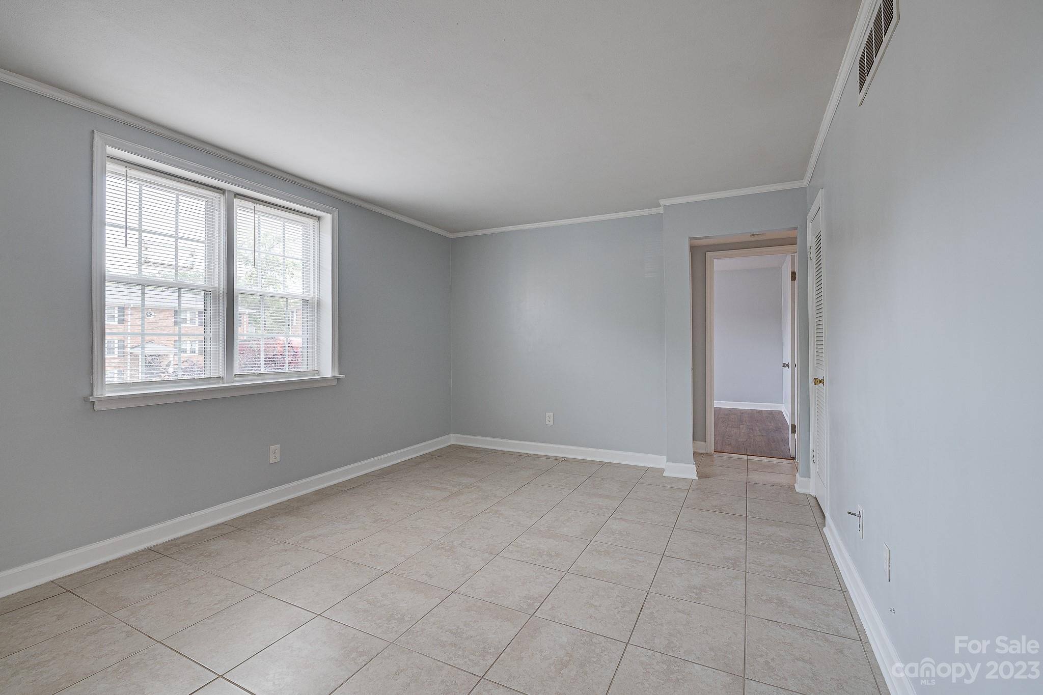 910 McAlway Road, Unit B Charlotte, NC 28211 - Photo 17 of 37 a view of an empty room with a window