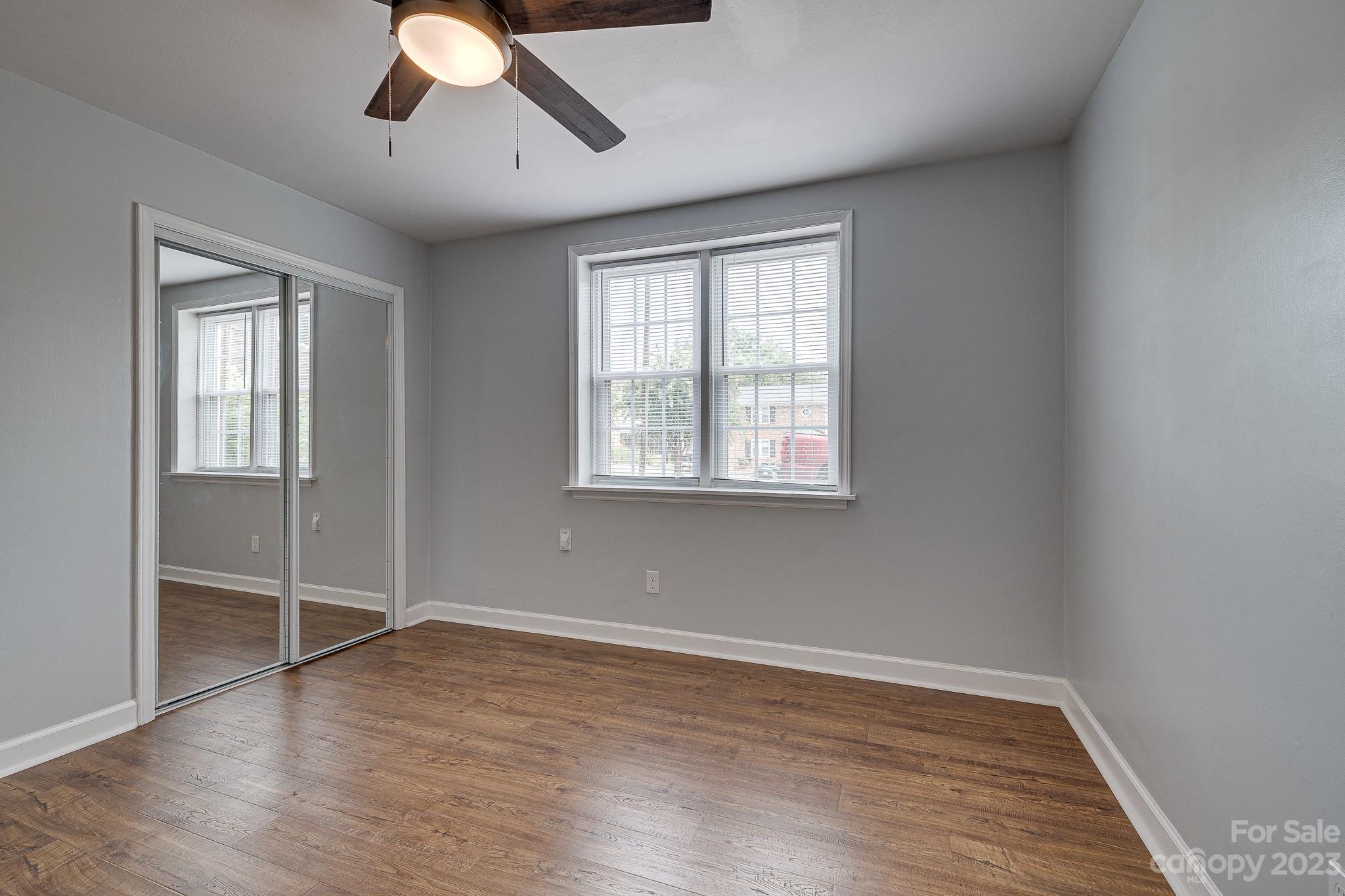 910 McAlway Road, Unit B Charlotte, NC 28211 - Photo 20 of 37 wooden floor in an empty room with a window