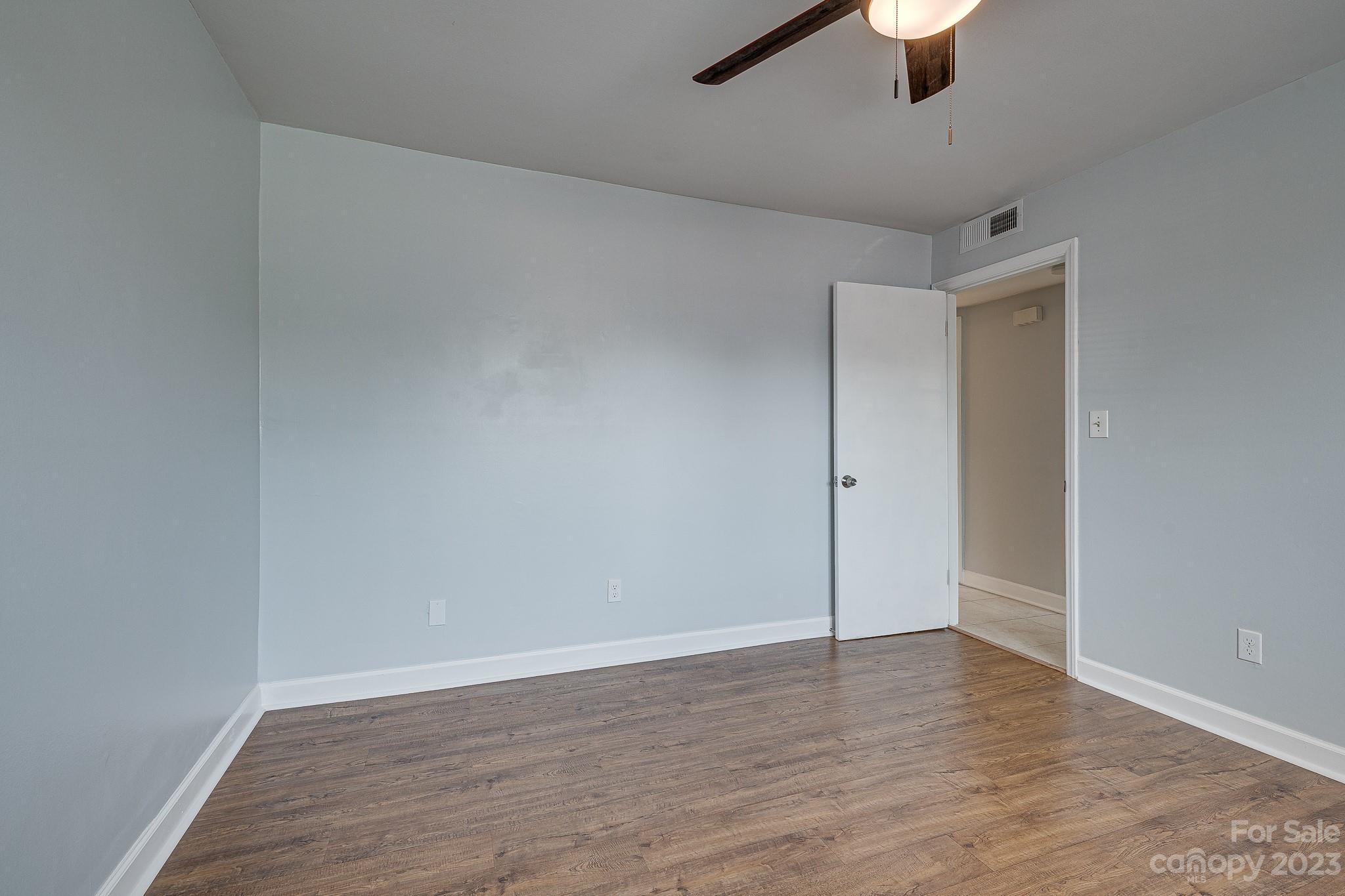 910 McAlway Road, Unit B Charlotte, NC 28211 - Photo 22 of 37 wooden floor in an empty room