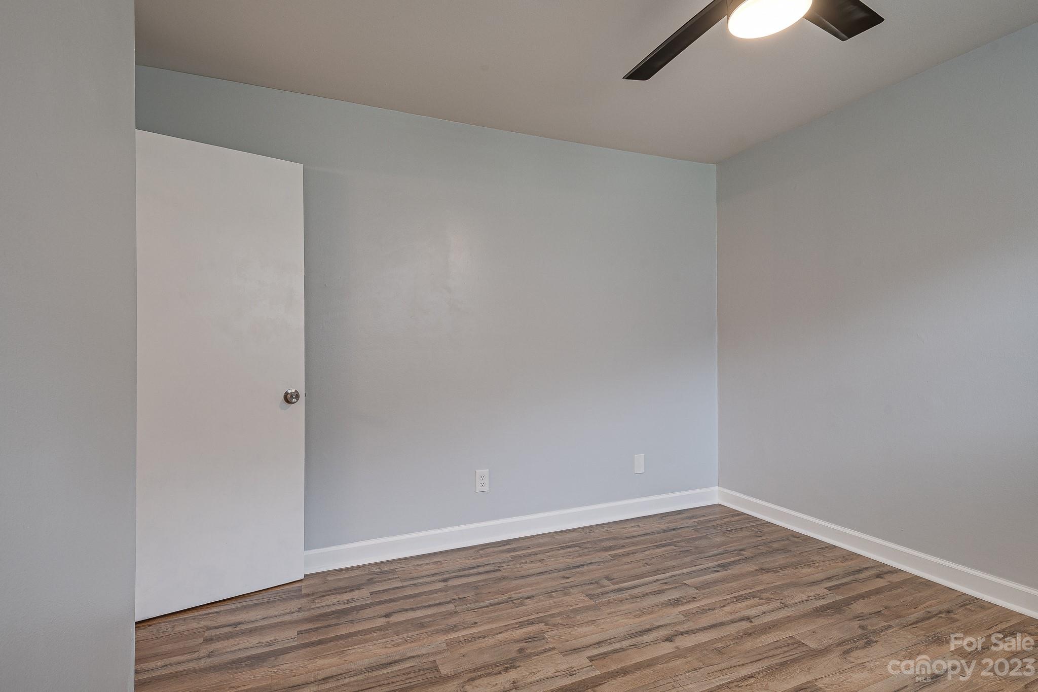 910 McAlway Road, Unit B Charlotte, NC 28211 - Photo 29 of 37 a view of an empty room with wooden floor cabinets