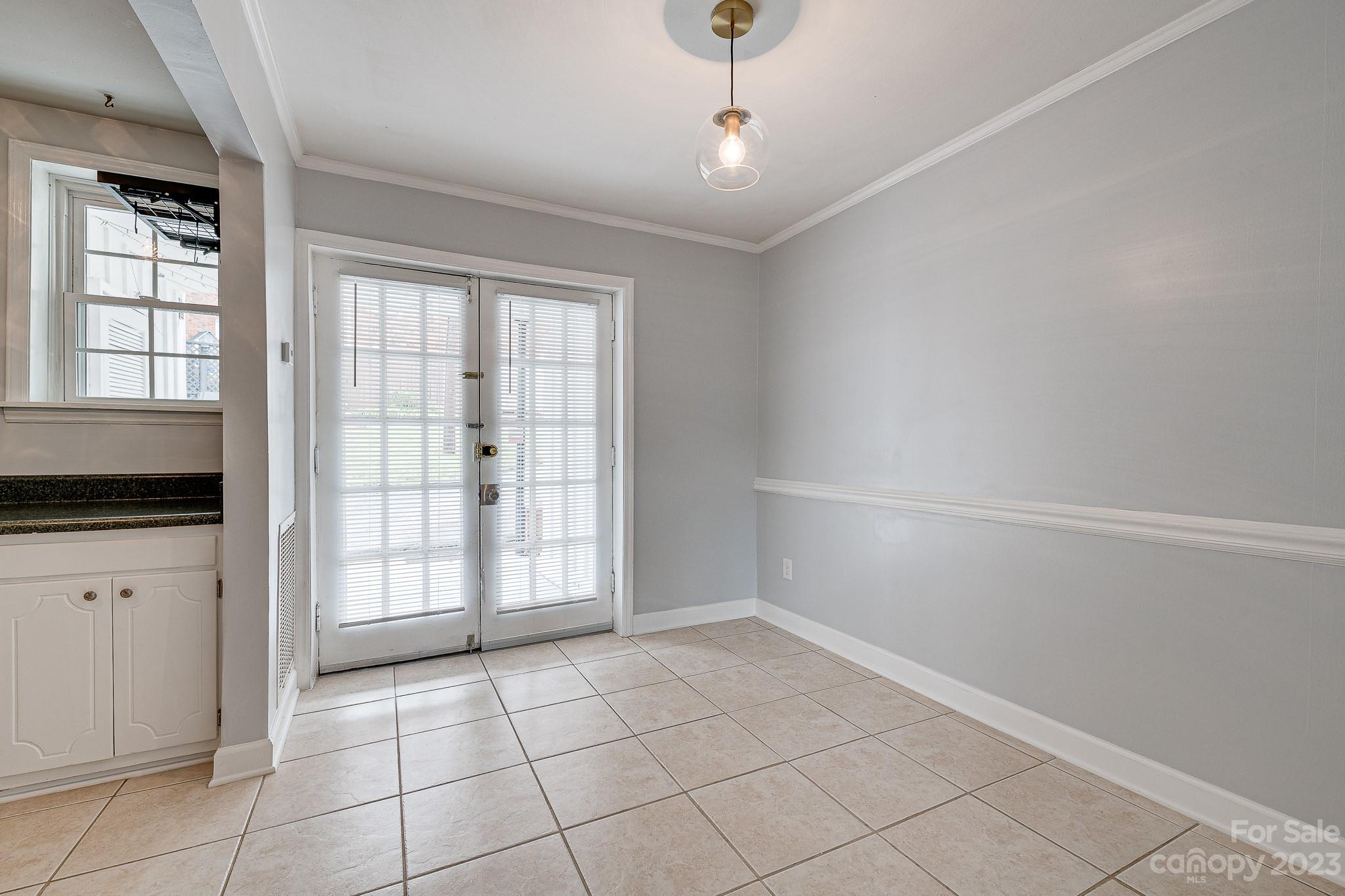 910 McAlway Road, Unit B Charlotte, NC 28211 - Photo 9 of 37 a view of an empty room with a window