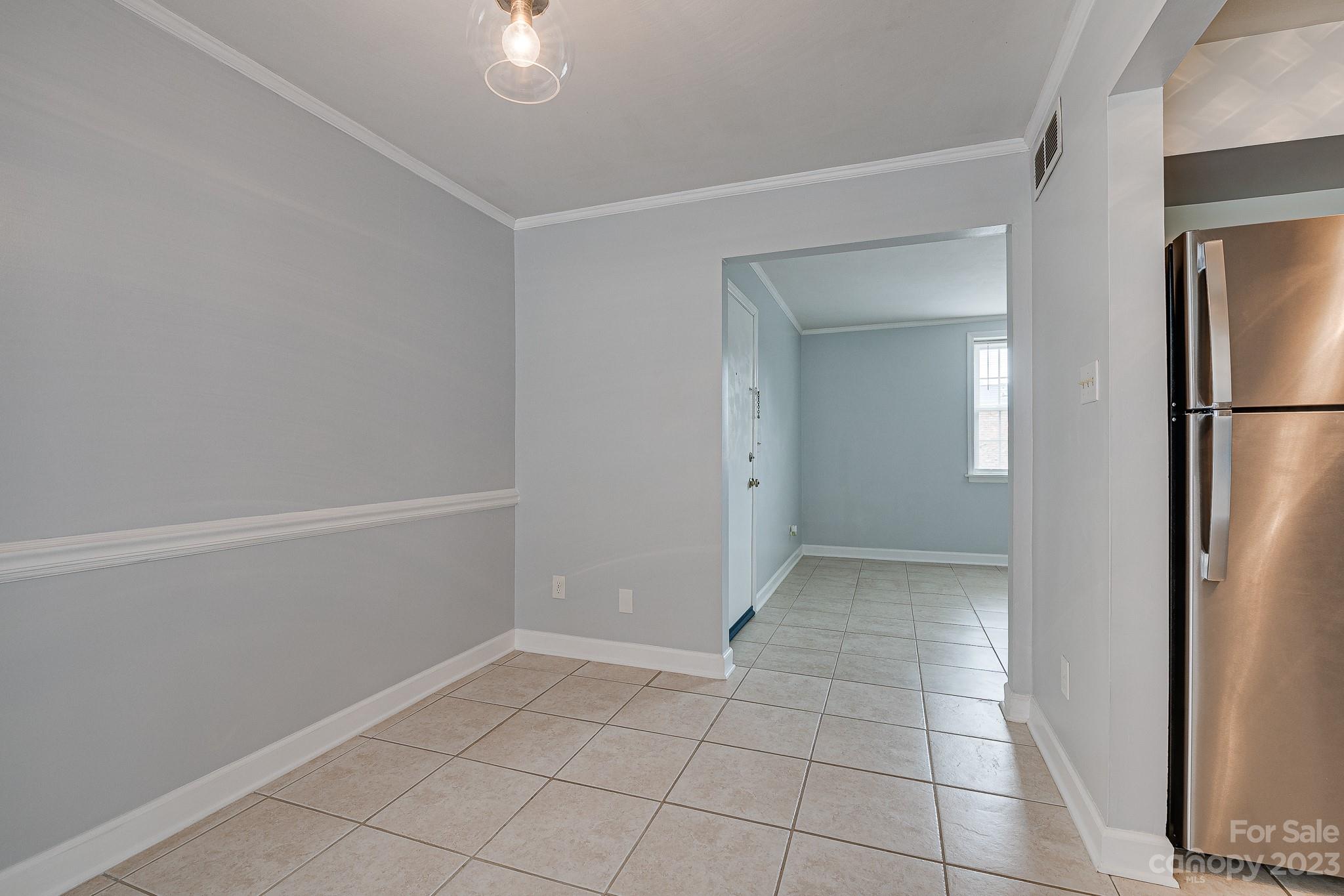 910 McAlway Road, Unit B Charlotte, NC 28211 - Photo 10 of 37 a view of an empty room with closet and a window