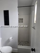 3801 Northwest 8th Court Lauderhill, FL 33311 - Photo 6 of 7 a bathroom with a shower and a toilet