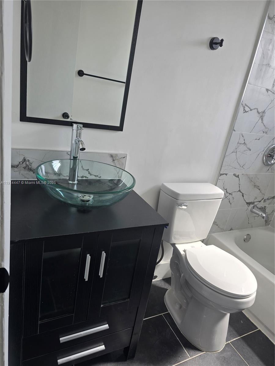 3801 Northwest 8th Court Lauderhill, FL 33311 - Photo 7 of 7 a bathroom with a sink and a toilet