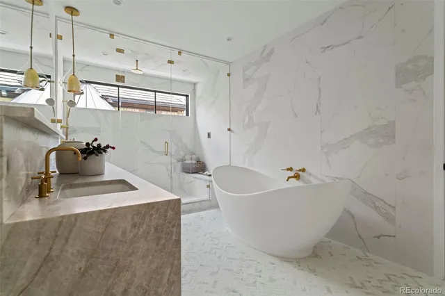 a spacious bathroom with a bathtub and shower