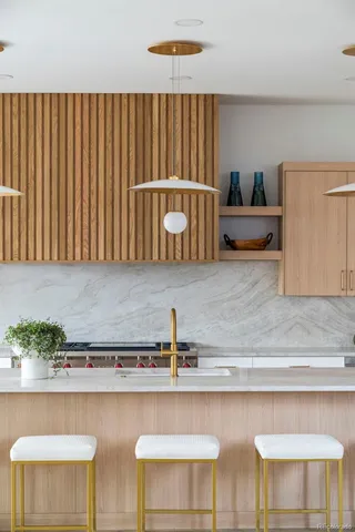 a kitchen with a table and chair