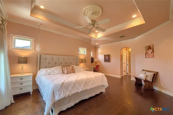 a bedroom with bed and window
