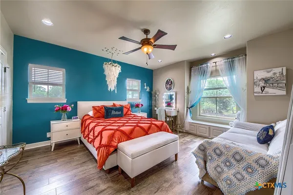 a bedroom with bed and window