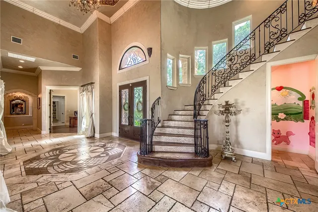 a view of a hallway with entryway wooden floor and front door