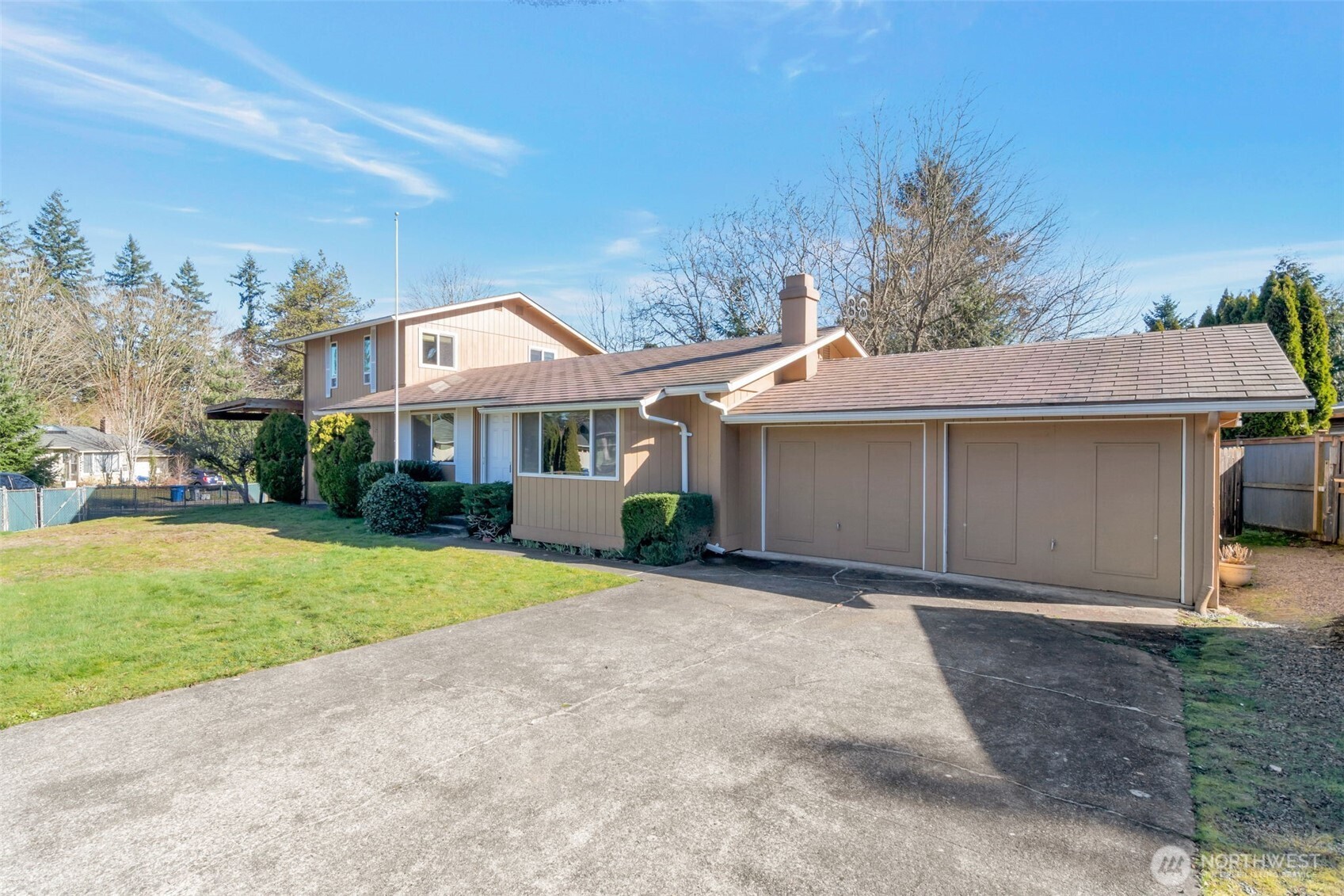 308 225th Street Southwest Bothell, WA 98021 - Photo 2 of 15 a front view of a house with a yard and garage