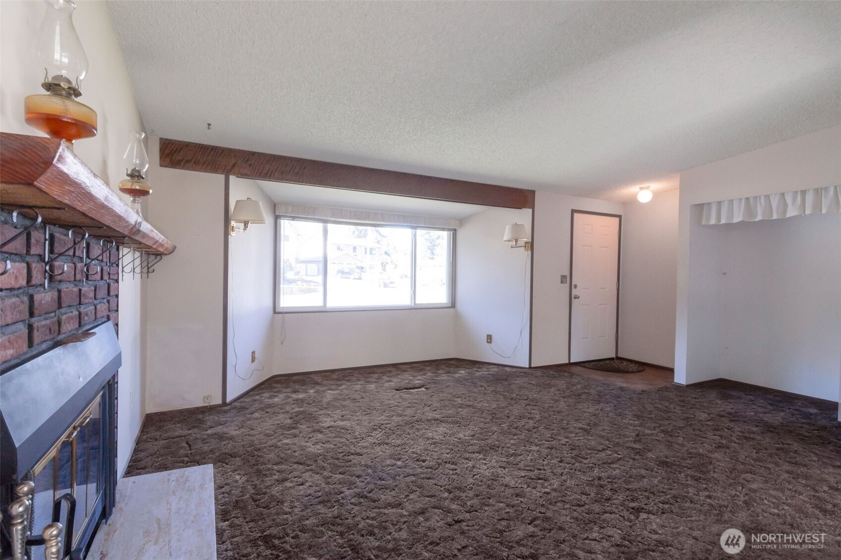 308 225th Street Southwest Bothell, WA 98021 - Photo 3 of 15 a view of an empty room with a fireplace
