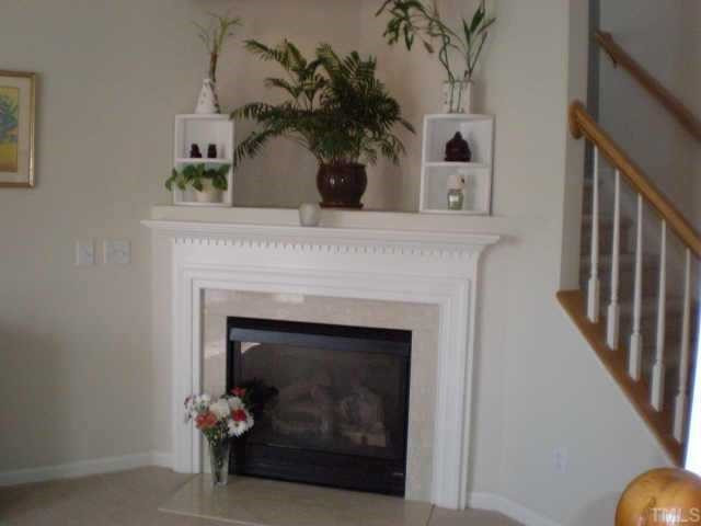 201 Caley Road Apex, NC 27502 - Photo 6 of 12 Fantastic gas fireplace in Living Room has a TV nook with wiring above. Other