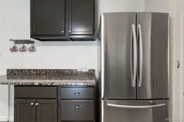 a view of a refrigerator in kitchen