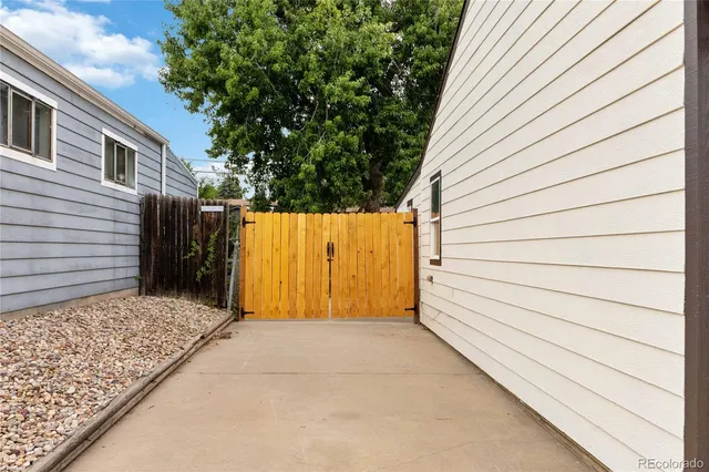 a view of small house with an outdoor space