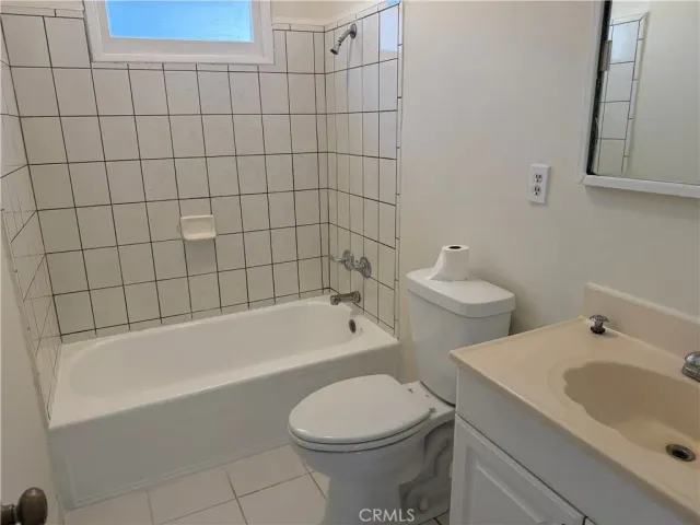 a bathroom with a bathtub and sink