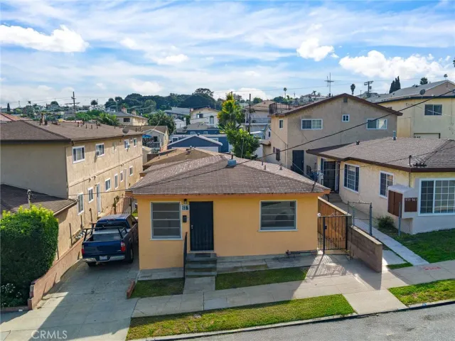 a aerial view of a house with a yard
