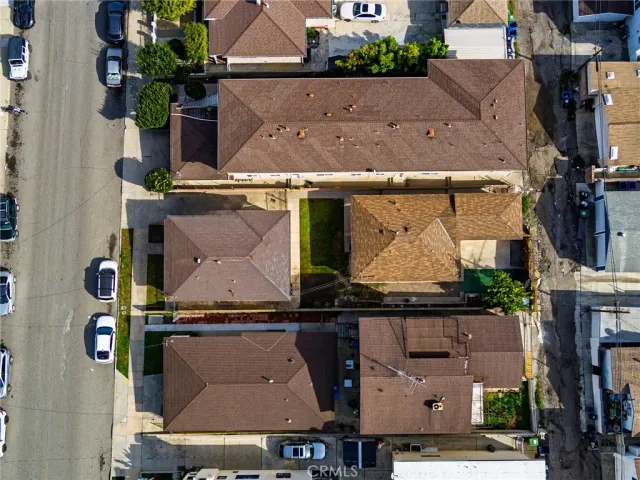an aerial view of houses with an outdoor space